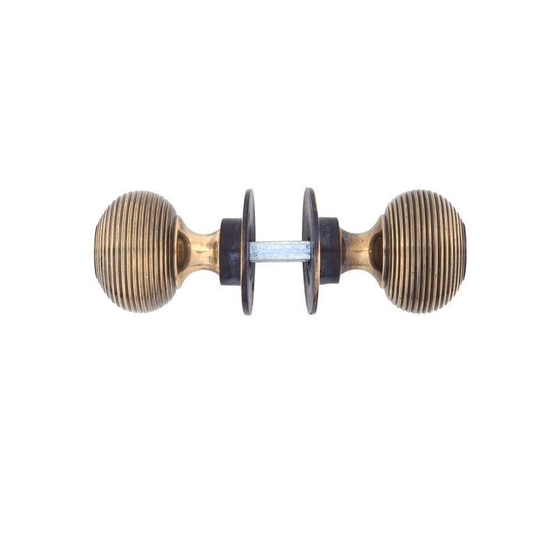 From The Anvil Beehive Knob Handles on Round Rose - Aged Brass