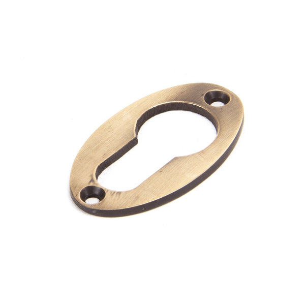 From The Anvil Period Euro Profile Oval Escutcheon - Polished Bronze